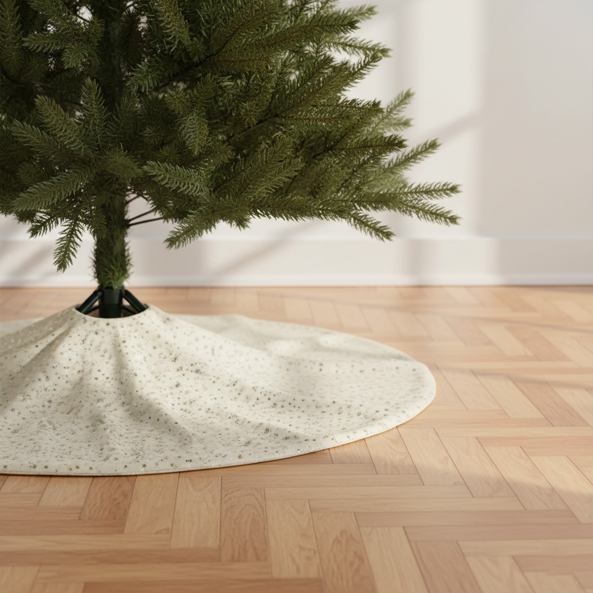 White sequined Christmas tree skirt on wooden parquet floor