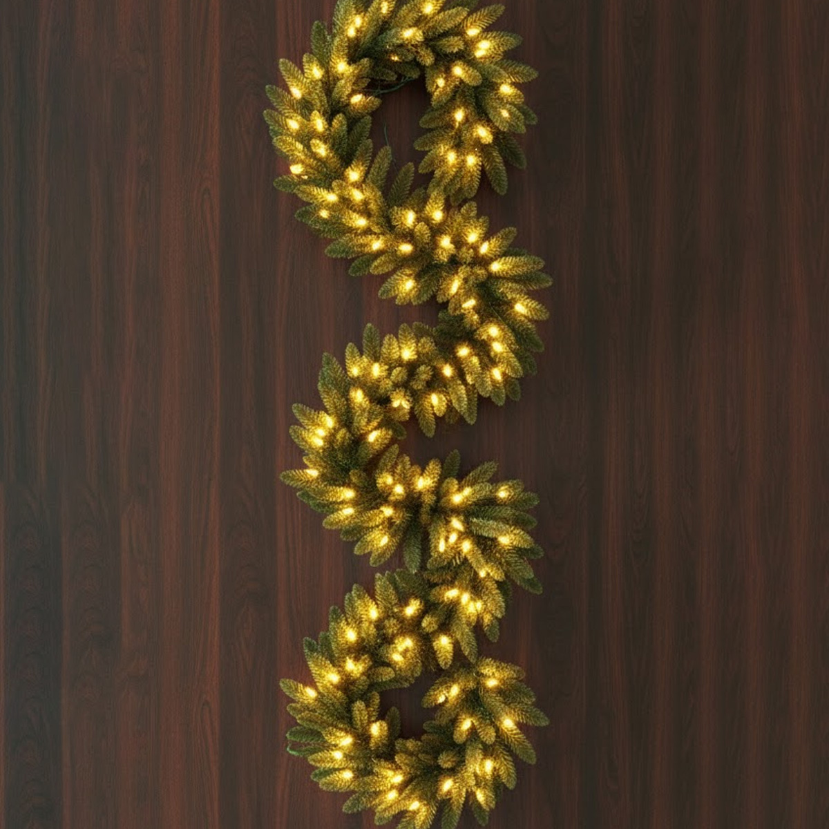 Illuminated S-shaped fir garland on a wooden background