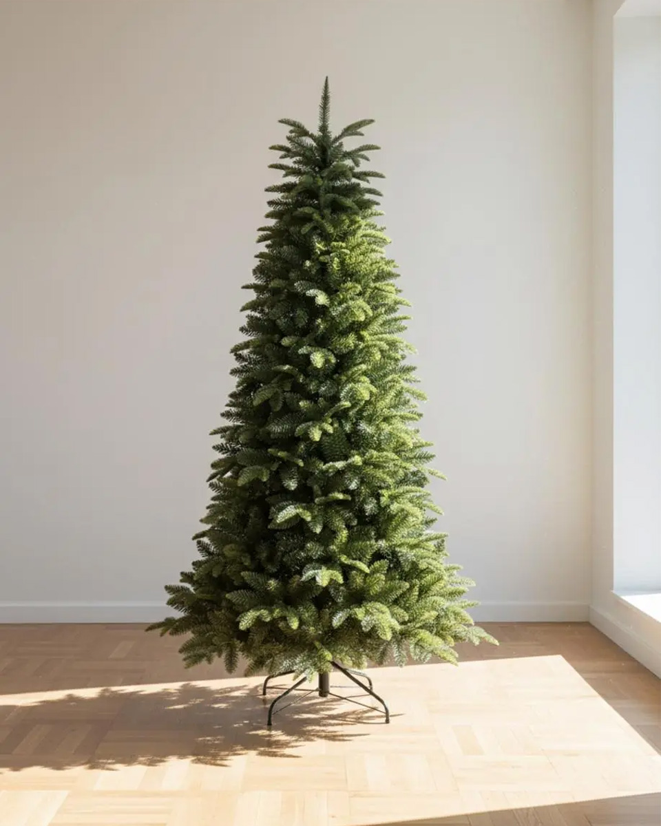 A green Christmas tree on a stand, in a bright room