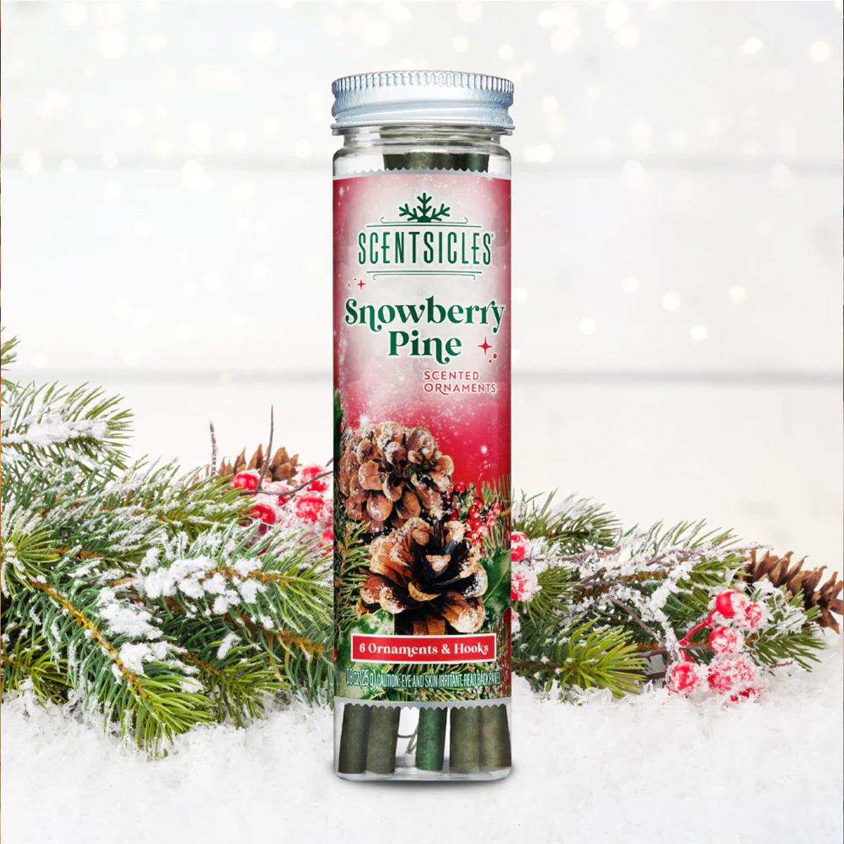 ScentSicles Snowberry Pine ornaments in a tube with pine branches