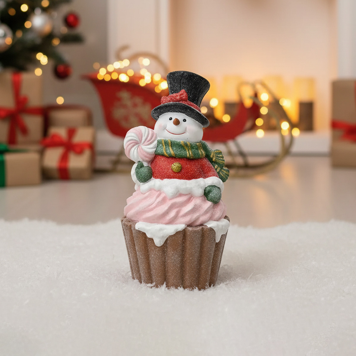 Bonhomme de neige cupcake avec sucette et décorations de Noël