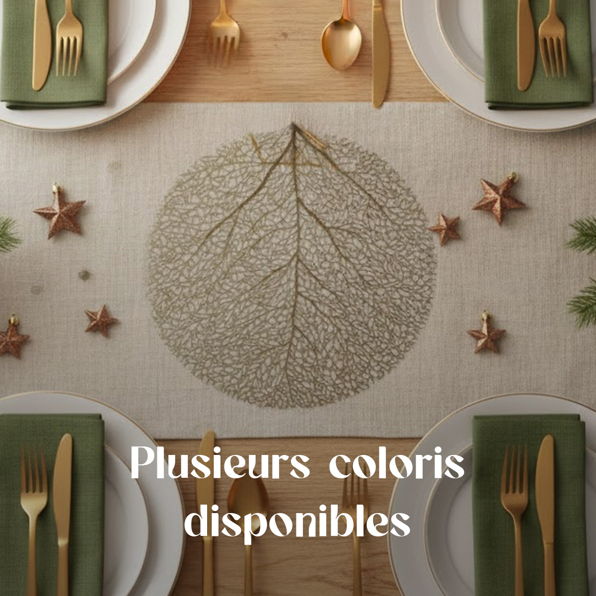 Table setting with gold cutlery, green napkins, and a leaf-patterned runner