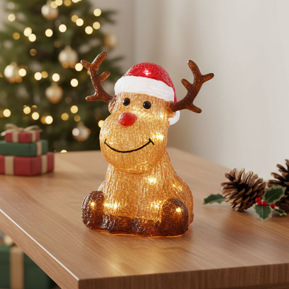 Renard lumineux de Noël avec un chapeau de Père Noël et un nez rouge