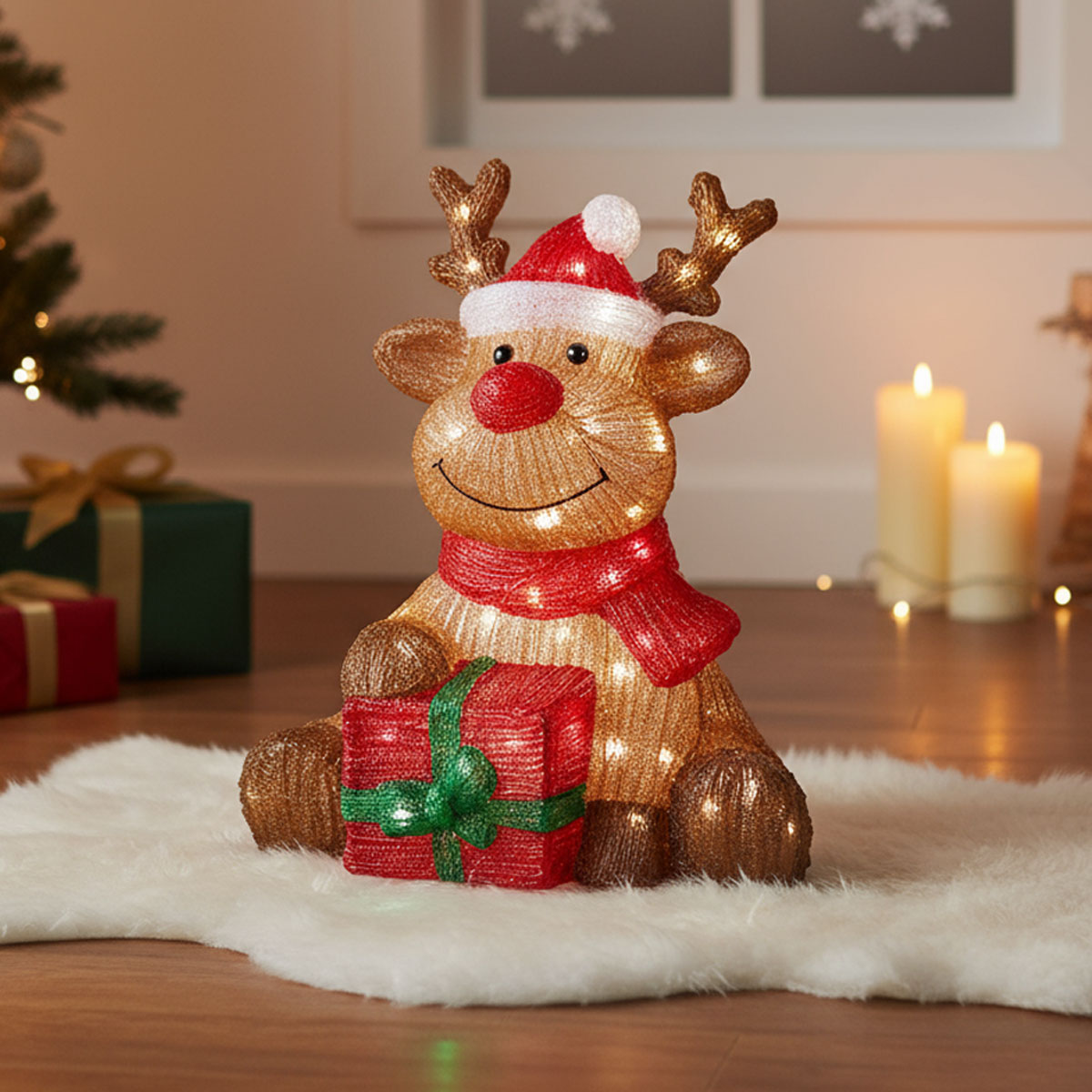 Renard lumineux de Noël avec un cadeau