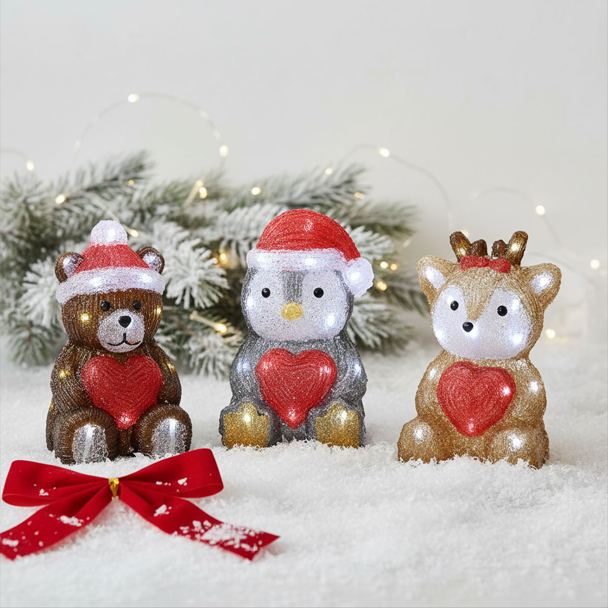 Figurines de Noël lumineuses : ours, pingouin et renne avec des cœurs