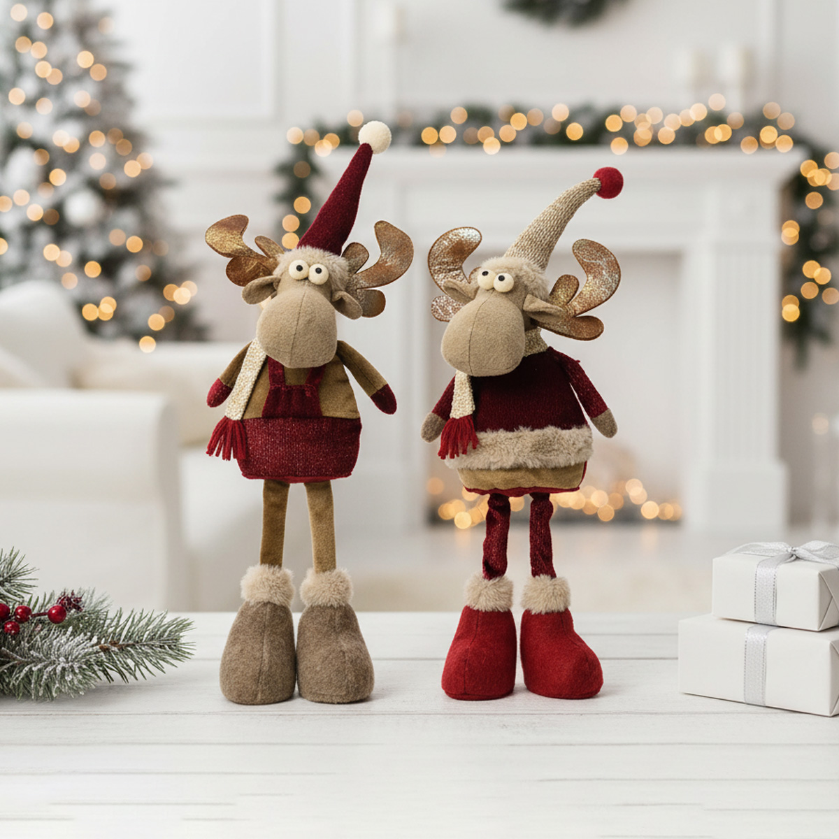 Deux rennes de Noël en peluche avec des jambes longues et des bonnets festifs