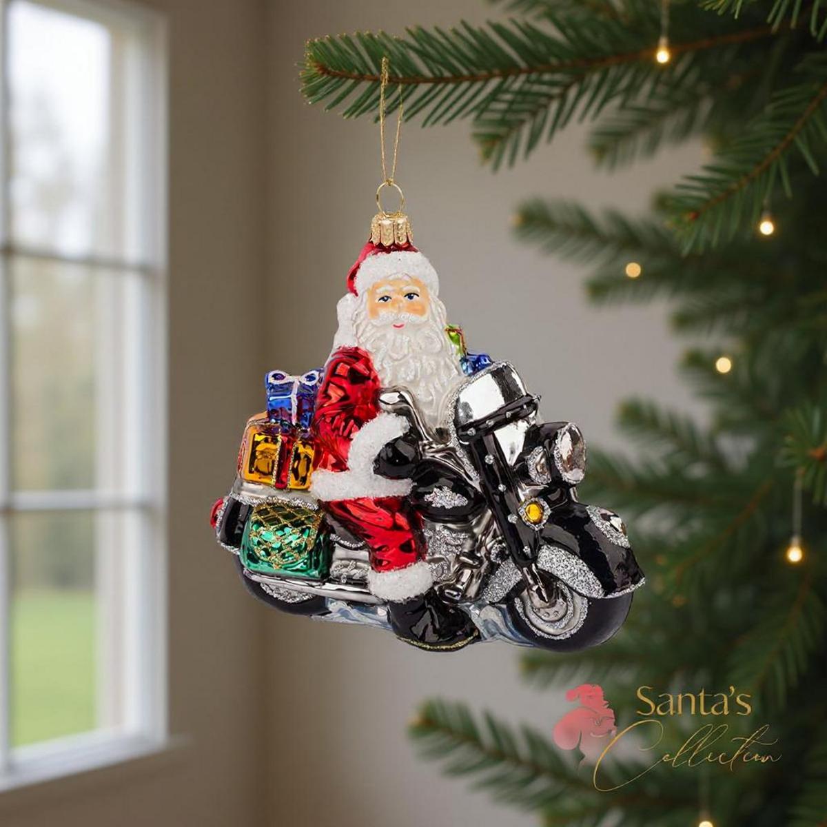 Ornamento di Babbo Natale in moto con regali su una moto