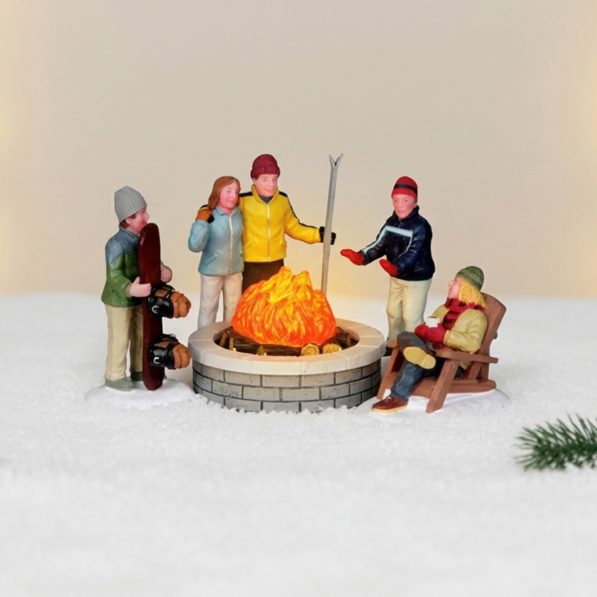 Figurines de skieurs et snowboarders autour d'un feu de camp
