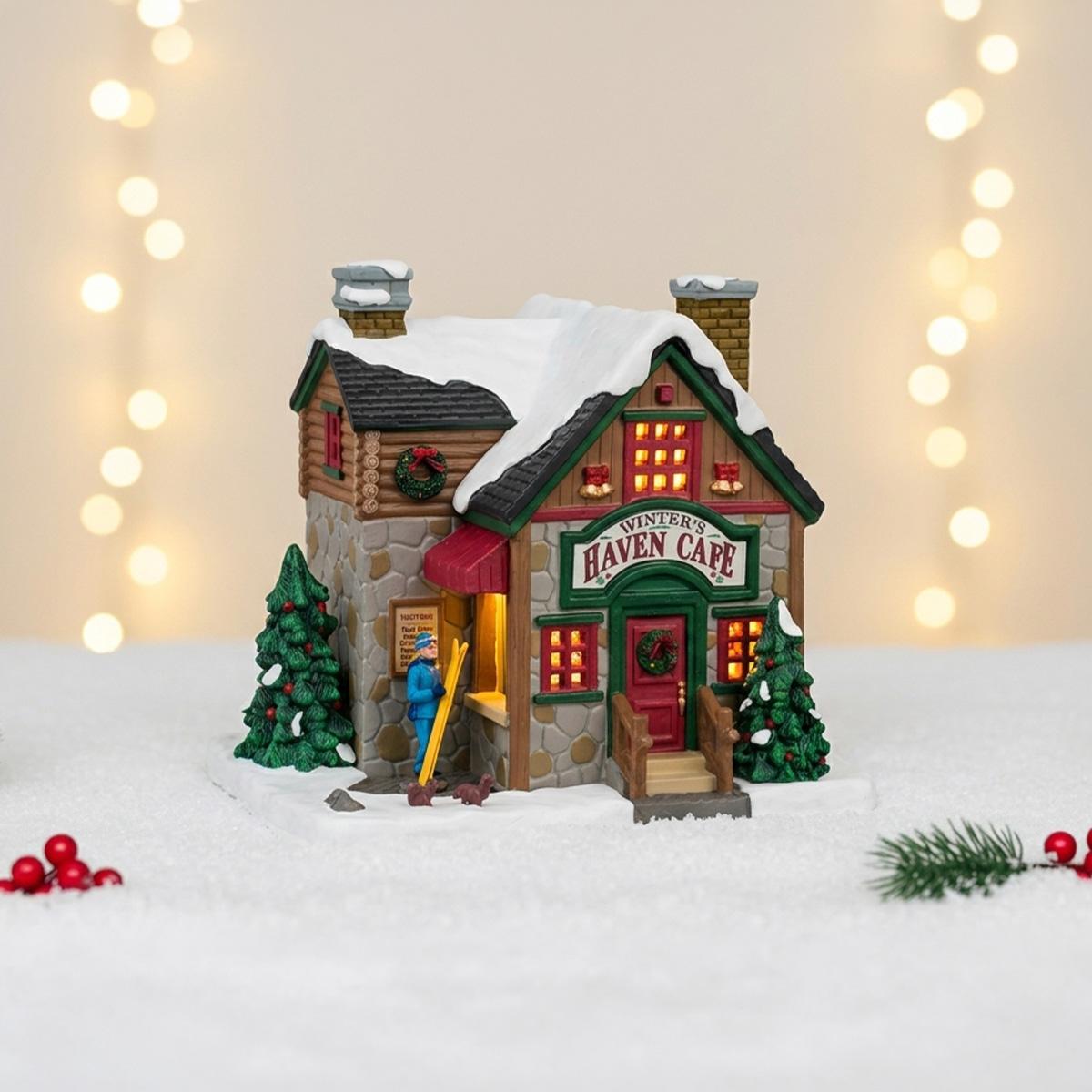 Maison de Noël "Winter's Haven Cafe" avec un skieur et des sapins enneigés