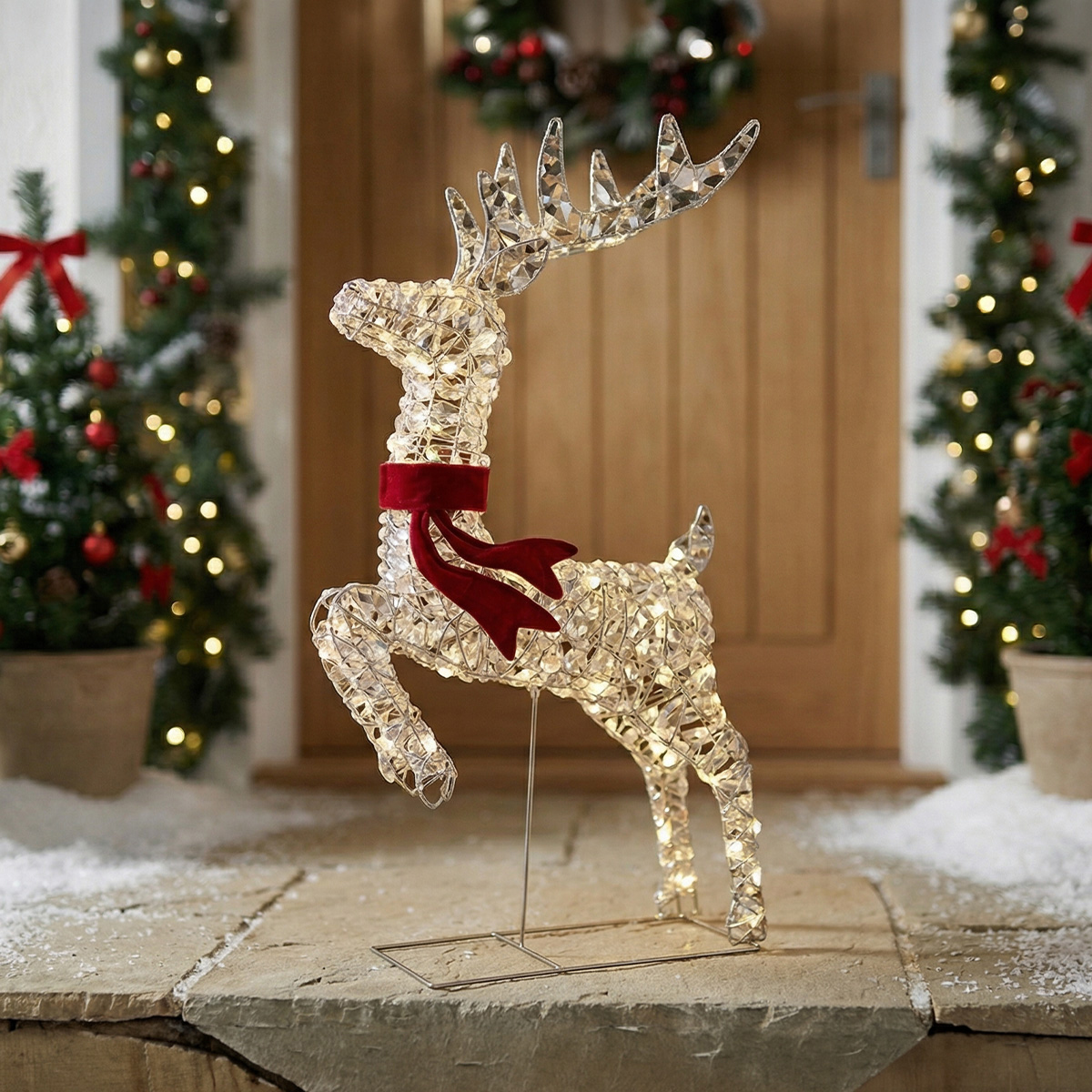 Renard lumineux de Noël avec un foulard rouge