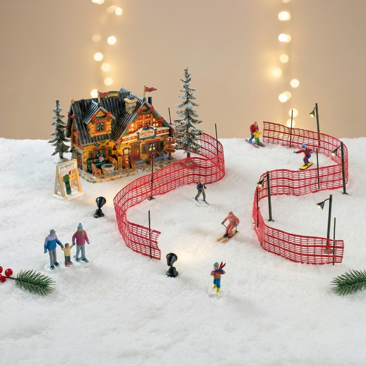 Village de ski miniature avec des skieurs et un chalet enneigé
