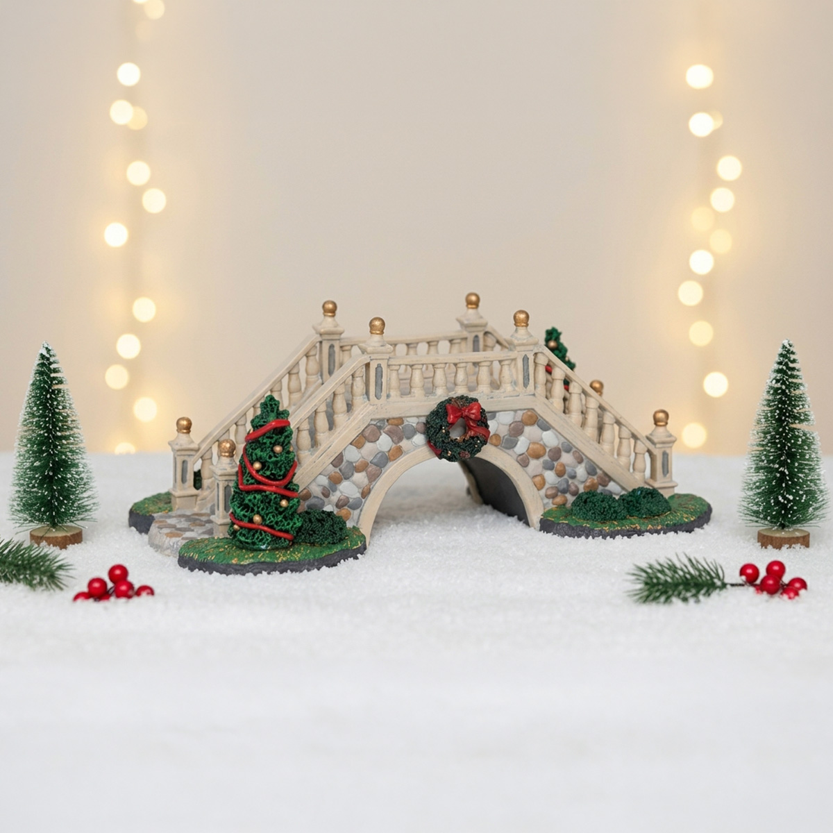 Pont de Noël miniature avec arbres et guirlandes lumineuses