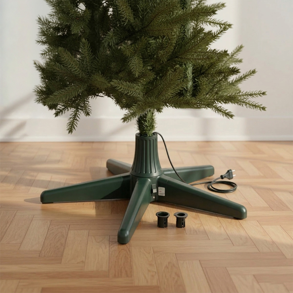 Pied de sapin vert avec un cordon d'alimentation et deux embouts